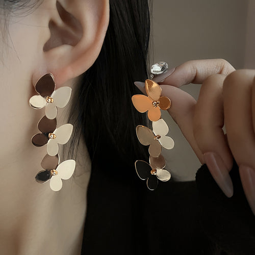 European and American light luxury high-end metal style simple personality earrings women's retro flower pearl hollow love earrings