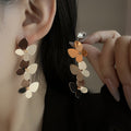 European and American light luxury high-end metal style simple personality earrings women's retro flower pearl hollow love earrings